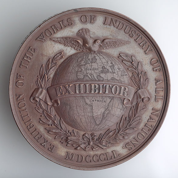 London Exhibition Medal and Crystal Palace postcard- <em>on show to the empire</em>